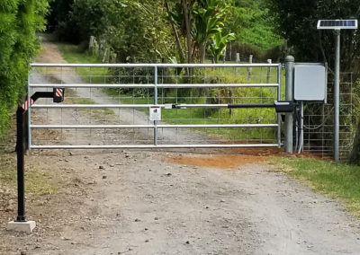 A standard entry automated gate system with solar panel.