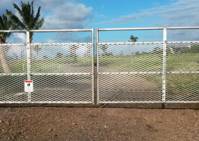 Double metal automated gate system over driveway, home entrance.